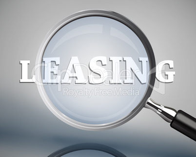 Magnifying glass showing leasing word in white