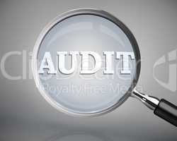 Magnifying glass showing audit word in white