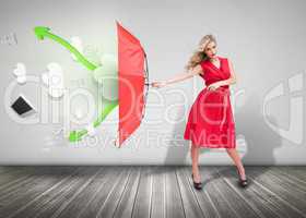 Woman wearing red dress and holding umbrella