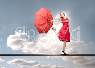 Beautiful woman standing on rope