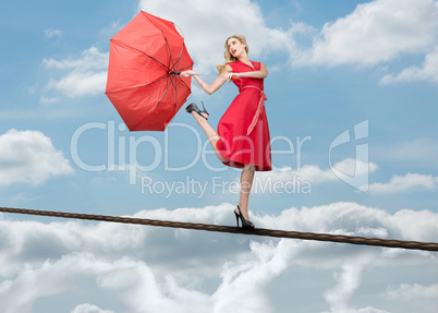 Pretty woman standing over the clouds