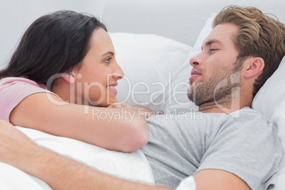 Couple awaking and looking at each other