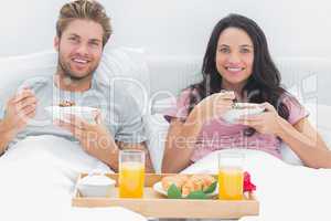 Couple eating cereal during a romantic breakfast