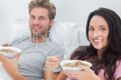 Couple eating cereal for breakfast