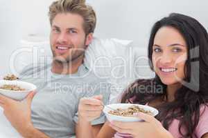 Couple eating cereal for breakfast