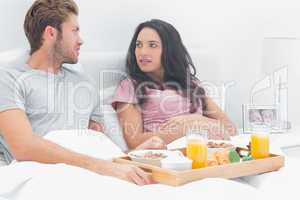 Couple looking at each other during breakfast