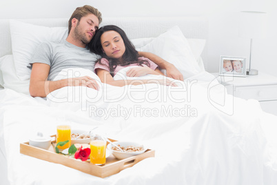 Couple sleeping in their bed