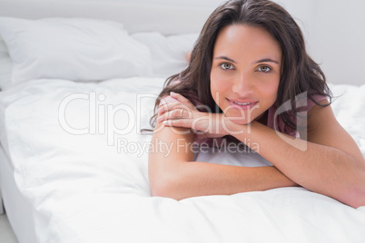 Peaceful woman lying on her bed