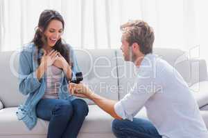 Handsome man doing a marriage proposal