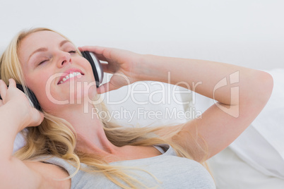 Woman listening to music with headphones