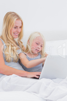 Mom and daughter using a laptop