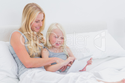 Mother and daughter using a tablet