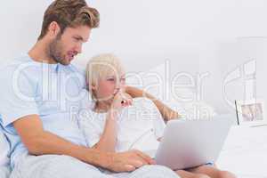 Handsome father and his son using a laptop