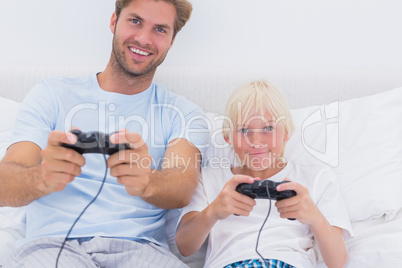 Father and son playing video games