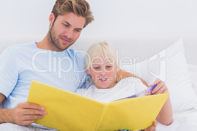 Father reading a story to his son