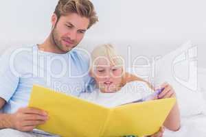 Father reading a story to his son