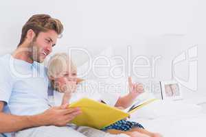 Father reading a story to son