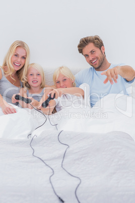 Cheerful family playing video games