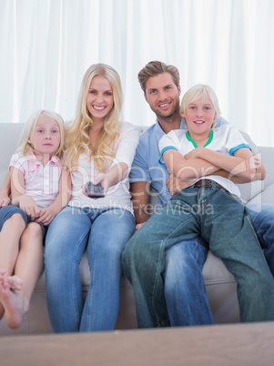 Parents and children watching TV