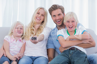 Happy family sitting on couch