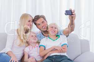 Family taking pictures of themselves