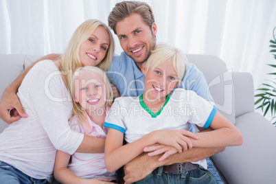 Family smiling at camera