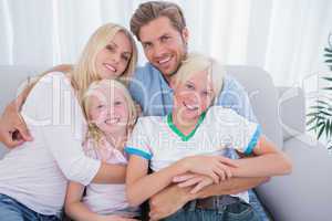 Family smiling at camera