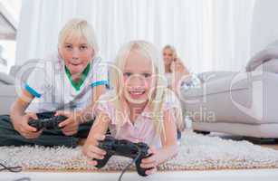 Siblings playing video games