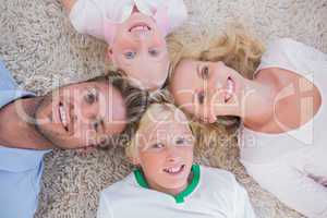 Overhead of family lying in a circle