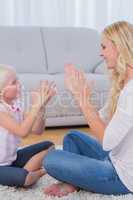 Mother playing with her daughter