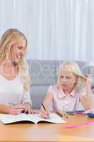 Mother and daughter drawing together