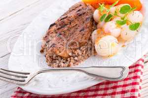 grill chop, buckwheat groats and roasted radishes