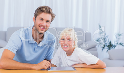 Father and his son using tablet