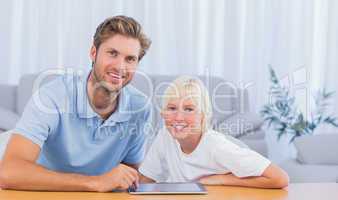 Father and his son using tablet