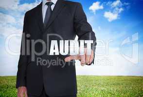 Businessman selecting audit word