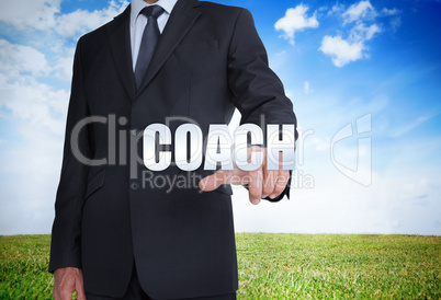 Businessman selecting coach word