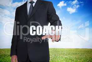 Businessman selecting coach word