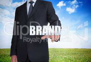 Businessman selecting brand word