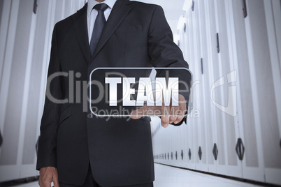 Businessman in a data center selecting label with team