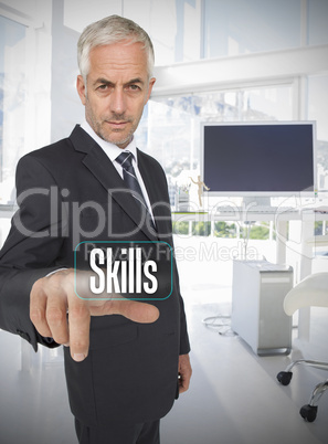 Businessman selecting the word skills