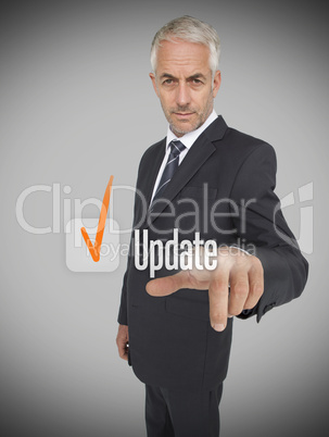 Businessman selecting the word update