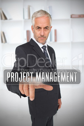 Serious businessman touching the term project management
