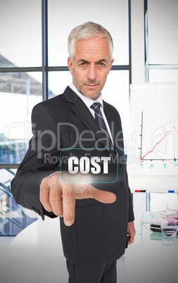 Businessman selecting the word cost