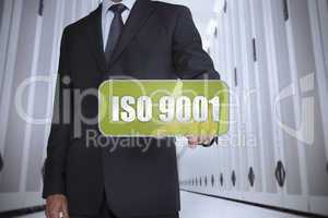 Businessman selecting a green label with iso 9001