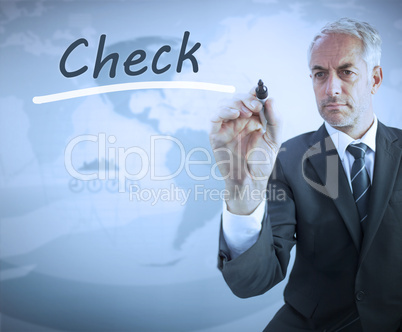 Businessman writing the word check