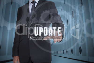 Businessman selecting a label with update written on it