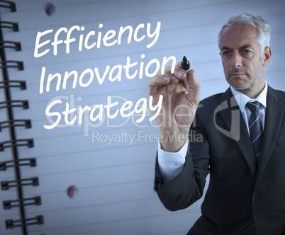 Businessman writing efficiency, innovation and strategy
