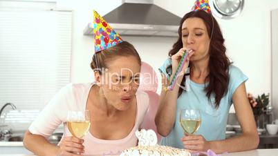 Woman blowing candle and celebrating her birthday
