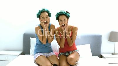 Friends with hair roller laughing together