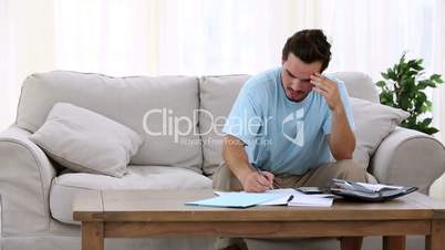 Stressed man sitting on sofa